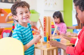 Kindergarten students smile when playing toy in playroom at preschool international,education concept.