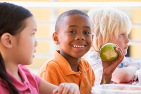 Kindergarten children eating lunch