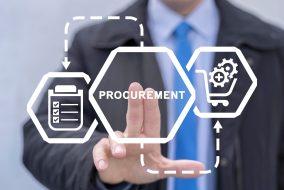 Businessman using virtual touchscreen presses word: PROCUREMENT. Concept of procurement. Product procurement management. Supply Chain Retail. Goods of delivery, logistic service, distribution.